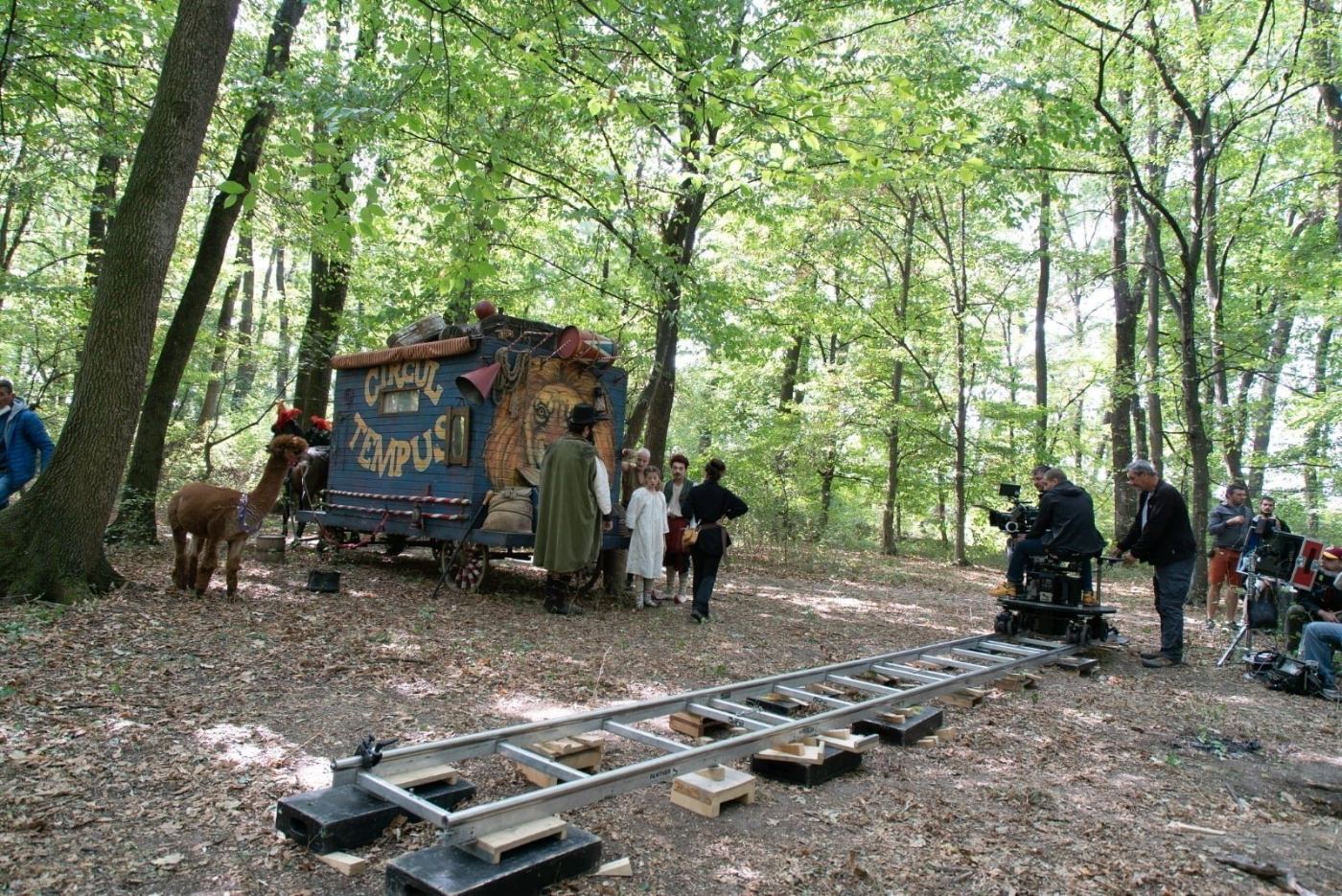 The film crew in the forest, with dolly tracks and the Circul Tempus set